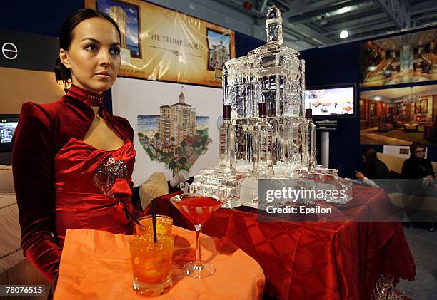 Waitress serves drinks at the Millionaire Fair 2007 at Crocus Expo November 22, 2007 in Moscow, Russia. The Millionaire Fair, the world's largest...