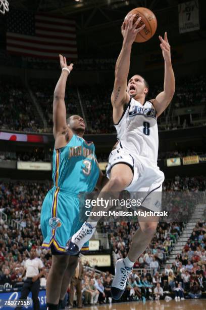 Deron Williams of the Utah Jazz shoots over Chris Paul of the New Orleans Hornets on November 23, 2007 at the EnergySolutions Arena in Salt Lake...