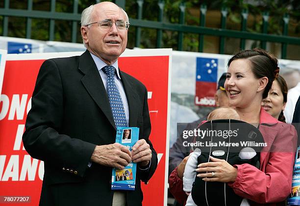 Prime Minister John Howard is greeted by daughter Melanie Howard-McDonald and grandson Angus at Ermington Primary School on November 24, 2007 in...