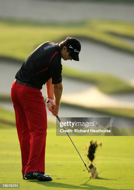 Justin Rose of England plays into the 14th green during the third round of the Omega Mission Hills World Cup at the Mission Hills Resort on November...