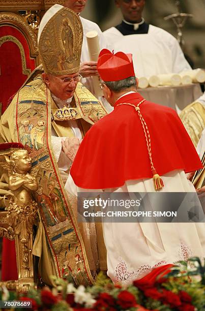Czech Republic's newly appointed cardinal Giovanni Coppa gets his red hat symbolising the blood of the martyrs from Pope Benedict XVI on St Peter...