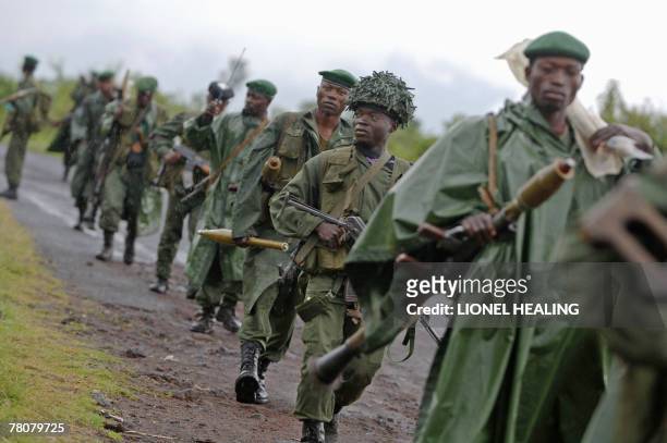 Government soldiers patrol a road, 24 November 2007, in Rugari, near Goma. Tension is rising in the North Kivu province of eastern Democratic...