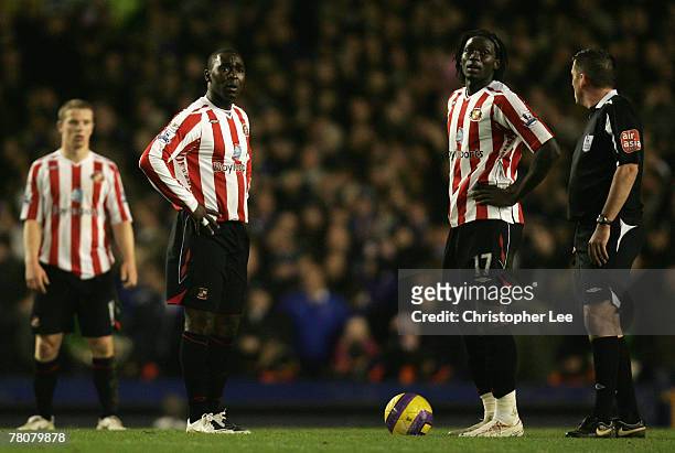 Andrew Cole and Kenwyne Jones of Sunderland dejectedly prepare to kick off after conceding a goal during the Barclays Premier League match between...