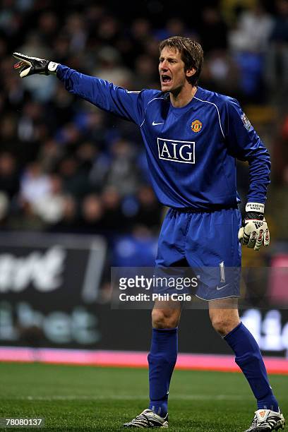 Manchester United's goalkeeper Edwin van der Sar gestures instructions during the Barclays Premier League match between Bolton Wanderers and...