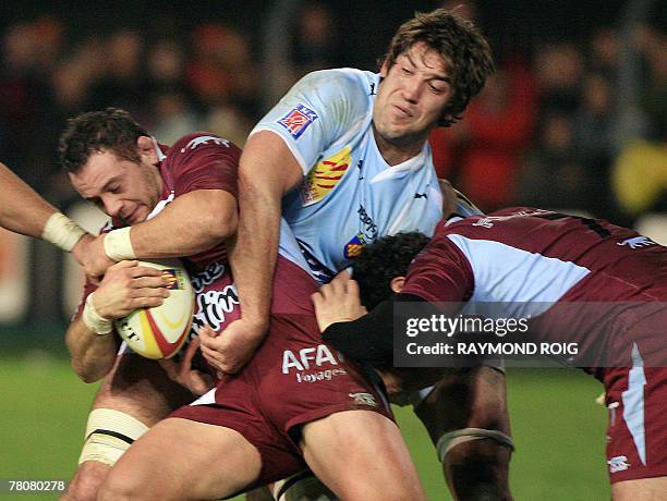 Bourgoin's hooker Benoit Cabelo vies with Perpignan's lock Nathan Hines during the French Top 14 rugby union match Perpignan vs. Bourgoin, 24...