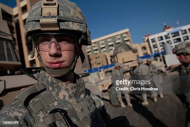 Private Jonathan Potter of Johnson Country, Tennessee, 19 years old, in the 2-69 Armored Battalion of the 3rd Infantry Division stands during a pause...