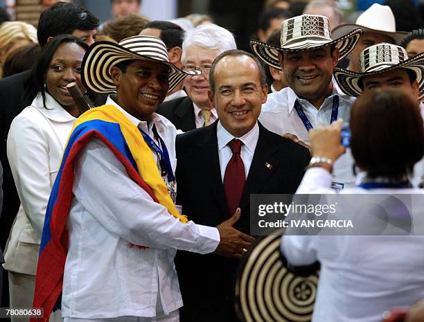 Mexican president Felipe Calderon poses for a picture with the Colombian delegation during the inauguration of the International Book Fair in...