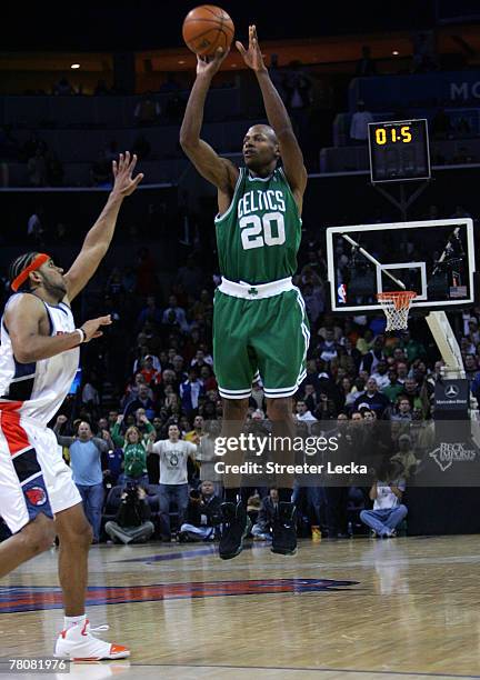 Ray Allen of the Boston Celtics shoots the game-winning shot as time expires over Jared Dudley of the Charlotte Bobcats at Charlotte Bobcats Arena on...