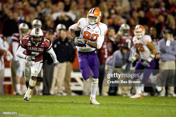 Addison Williams of the South Carolina Gamecocks defends as Aaron Kelly of the Clemson Tigers picks up a first down on 4th and 4 at Williams-Brice...