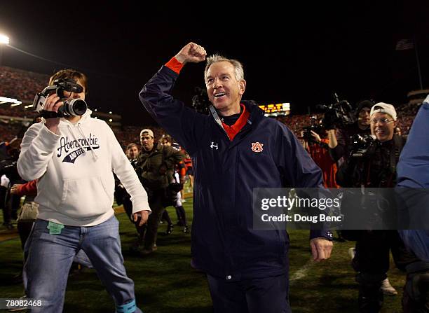 Head coach Tommy Tuberville of the Auburn Tigers celebrates after his team's victory over the Alabama Crimson Tide at Jordan-Hare Stadium on November...