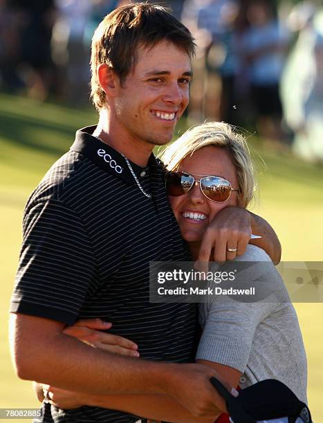 Aaron Baddeley of Australia is congratulated by his wife Richelle after winning the MasterCard Masters at Huntingdale Golf Course on November 25,...