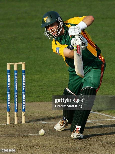 Michael Dighton of the Tigers drives during the Ford Ranger Cup match between the New South Wales Blues and the Tasmanian Tigers at North Sydney Oval...