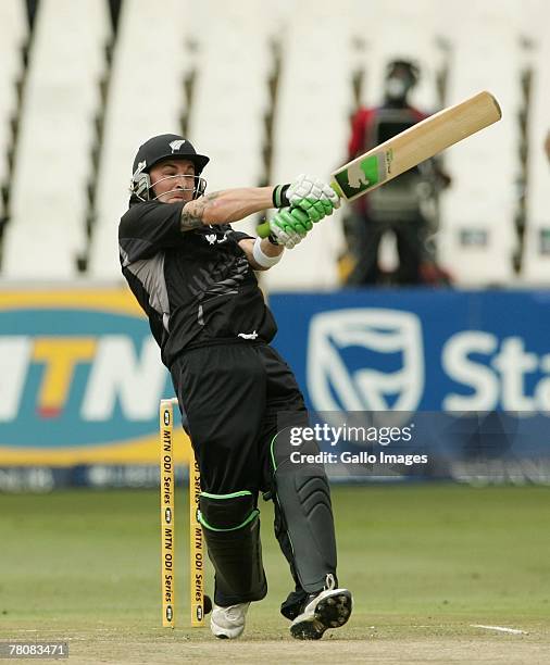 Brendon McCullum of New Zealand hits 4 runs off Shaun Pollock of South Africa during the first ODI match between South Africa and New Zealand held at...