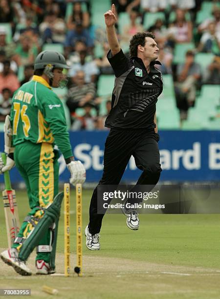 Morne van Wyk of South Africa is bowled out by Kyle Mills of New Zealand celebrate the wicket of Jacques Kallis of south Africa leaves the field out...