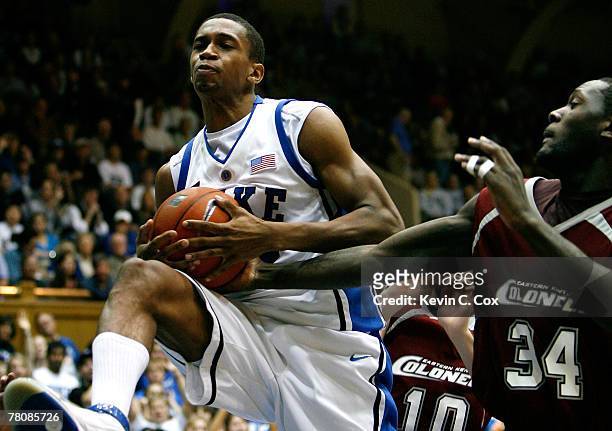 Lance Thomas of the Duke Blue Devils grabs a rebound against Jamaal Douglas of the Eastern Kentucky Colonels during the second half at Cameron Indoor...