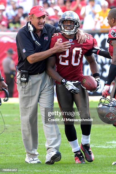 Cornerback Ronde Barber and defensive coordinator Monte Kiffin of the Tampa Bay Buccaneers celebrate an interception against the Washington Redskins...