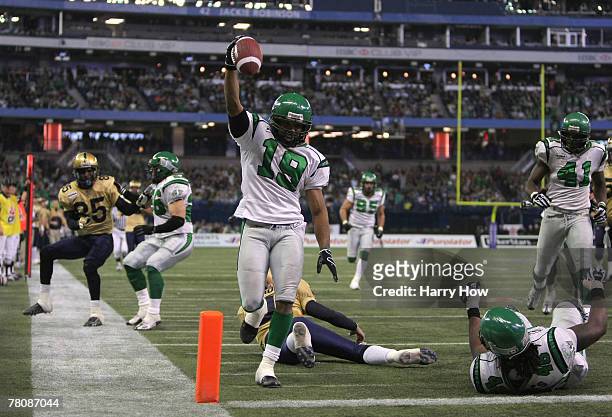 James Johnson of the Saskatchewan Rough Riders celebrates his interception for a touchdown to tie the game 7-7 against the Winnipeg Blue Bombers...