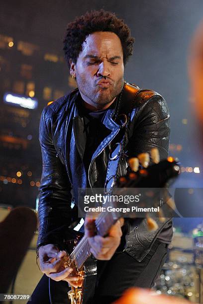 Musician Lenny Kravitz performs during the halftime show at the CFL's 95th Grey Cup Championship at the Rogers Centre on November 25, 2007 in...