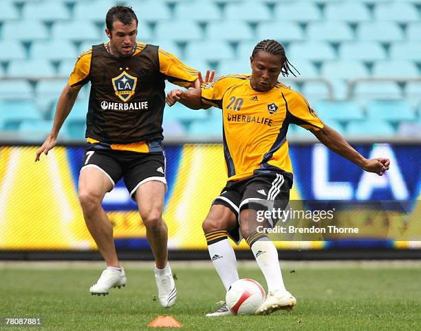 Carlos Pavon competes with Chris Klein during an LA Galaxy training session at Telstra Stadium on November 26, 2007 in Sydney, Australia.