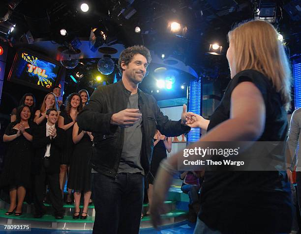 Patrick Dempsey dances with TRL audience member at MTV's "TRL" Studios in Times Square on November 19, 2007