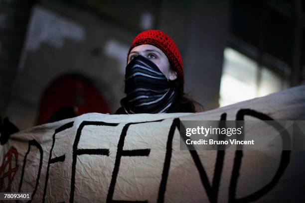 Masked woman protests outside the Oxford Union Debating Society on November 26, 2007 in Oxford, London. Both Historian David Irving, who was jailed...