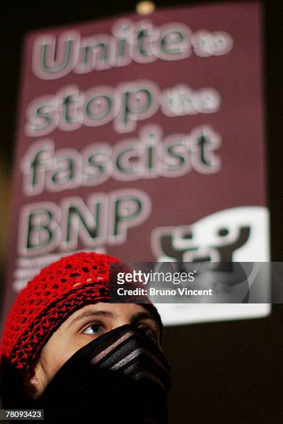 Masked woman protests outside the Oxford Union Debating Society on November 26, 2007 in Oxford, London. Both Historian David Irving, who was jailed...