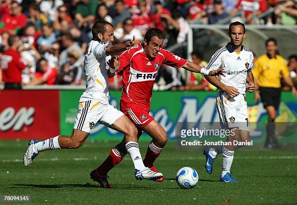 Peter Vagenas of the Los Angeles Galaxy and Cuauhtemoc Blanco of the Chicago Fire vie for the ball during their MLS match on October 21, 2007 at...