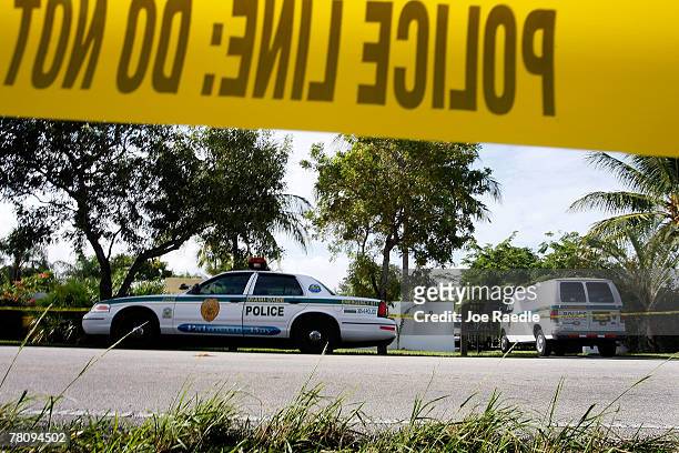 Police cars are seen in front of the home where an intruder shot Washington Redskins football player Sean Taylor in the leg November 26, 2007 in...