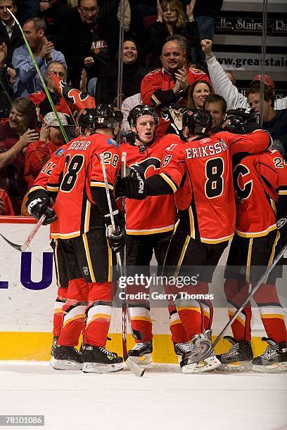 Dion Phaneuf of the Calgary Flames and teammates celebrate a goal against the Chicago Blackhawks on November 22, 2007 at Pengrowth Saddledome in...