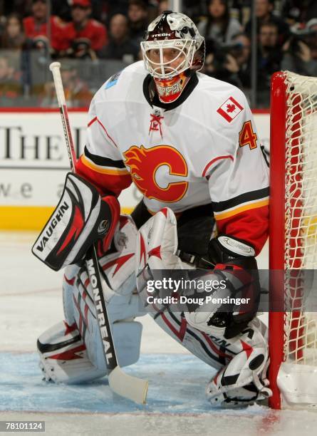 Goaltender Miikka Kiprusoff of the Calgary Flames defends the goal against the Colorado Avalanche in the third period at the Pepsi Center on November...
