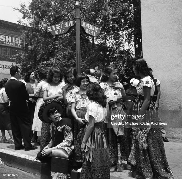 Mexican American children in native costumes gather at the corner Sunst Boulevard and Olvera Street on May 23 1954 in Los Angeles California.