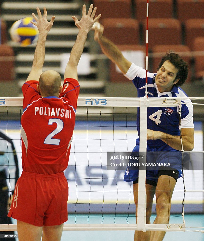 Victor Rivora Puerto Rican Victor Rivera spikes the ball through the block of... News ...