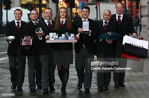 The Magnificent Seven Butlers pose on Regent Street on November 27, 2007 in London, England. The highly trained butlers will assist shoppers on...