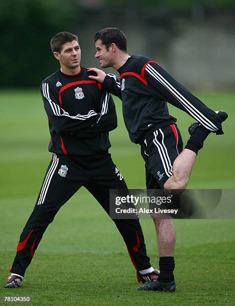 Steven Gerrard and Jamie Carragher of Liverpool warm up during the Liverpool training session held at Melwood Training Complex on November 27, 2007...