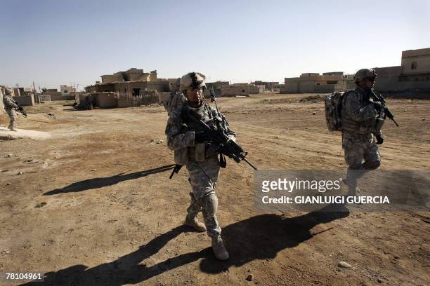 Soldiers from Bravo company, 1st Battallion, 38 regiment infantry patrol to search Iraqi houses for weapons and suspects as part of the operation...