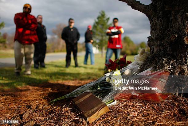 Redskins fans gather beside a makeshift memorial for safety Sean Taylor outside Redskins Park November 27, 2007 in Ashburn, Virginia. Taylor died...