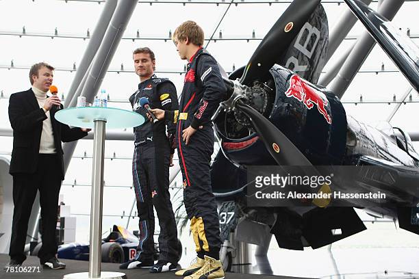 David Coulthard of the Red Bull Formula One Team and Sebastian Vettel of the Torro Rosso Team are interviewed on the stage during the Puma Red Bull...