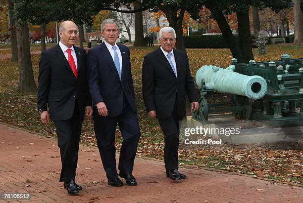 President George W. Bush walks with Israeli Prime Minister Ehud Olmert and Palestinian Authority President Mahmoud Abbas to the joint statement...