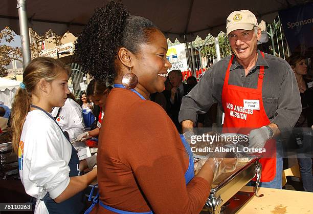 Actor Harrison Ford participates in serving in serving Thanksgiving dinner to the Skid Row homeless at the Los Angeles Mission hosted by Kirk Douglas...