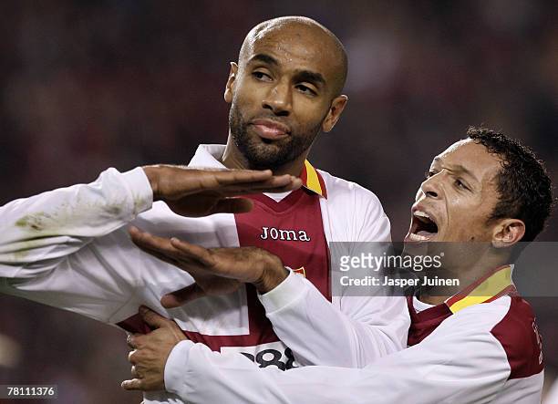 Frederic Kanoute of Sevilla celebrates his goal with his teammate Adriano during the UEFA Champions League Group H match between Sevilla and Arsenal...