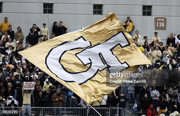 Cheerleader waves the Georgia Tech flag during the game against the Georgia Bulldogs on November 24, 2007 at Bobby Dodd Stadium at Historic Grant...