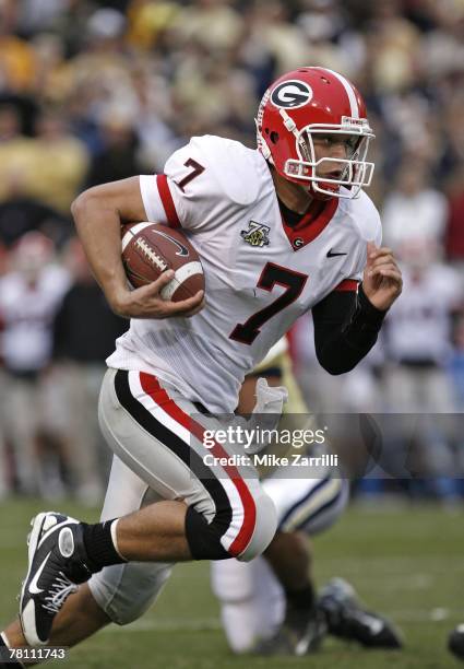 Quarterback Matthew Stafford of the Georgia Bulldogs rushes for a second quarter touchdown during the game against the Georgia Tech Yellow Jackets on...