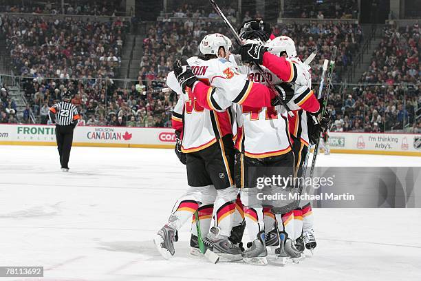 Members of the Calgary Flames celebrate a goal against the Colorado Avalanche at the Pepsi Center on November 24, 2007 in Denver, Colorado. The...