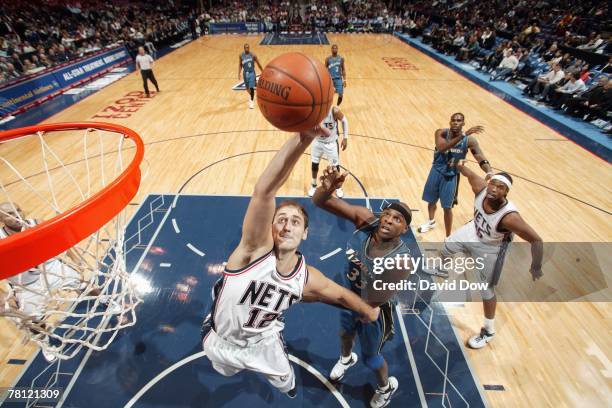 Nenad Krstic of the New Jersey Nets goes up for a shot against Brendan Haywood of the Washington Wizards at the IZOD Center on November 8, 2007 in...