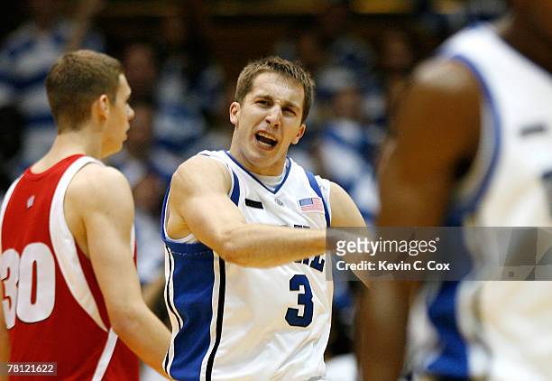 Greg Paulus of the Duke Blue Devils reacts after scoring a three-point basket against the Wisconsin Badgers during the first half at Cameron Indoor...