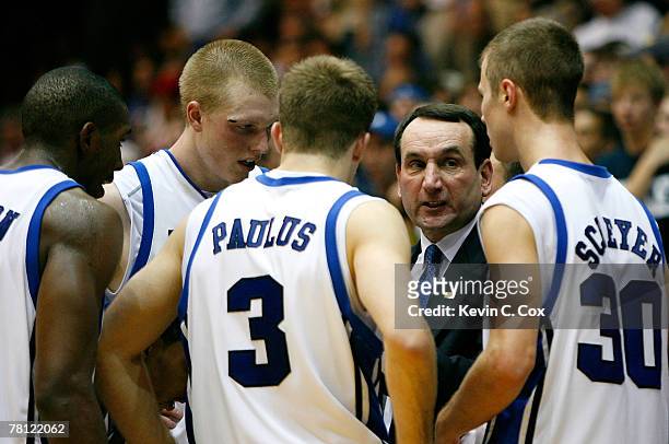 Head coach Mike Krzyzewski of the Duke Blue Devils brings his team together during the second half against the Wisconsin Badgers at Cameron Indoor...