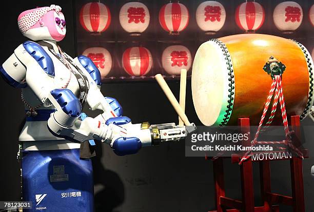 Hits traditional Japanese drum during the 2007 International Robot Exhibition at Tokyo Big Site on November 28, 2007 in Tokyo, Japan. The newest...