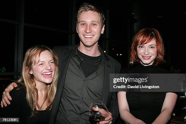 Actors and cast members Elisabeth Moss, Aaron Staton and Christina Hendricks pose prior to the SAG/"Mad Men" panel at the Landmark Theatre on...