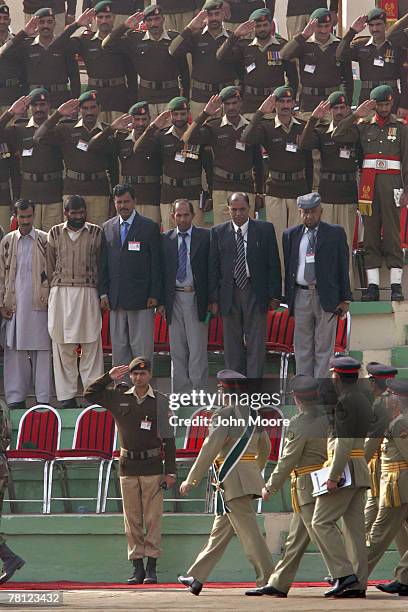 Pakistani army troops give a farewell salute to President Pervez Musharraf at a change of command ceremony on November 28, 2007 in Rawalpindi,...