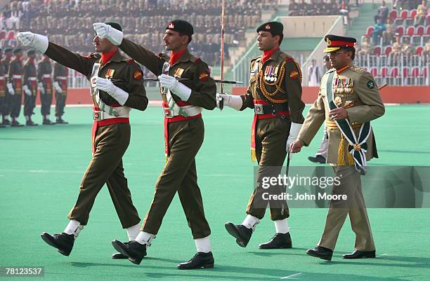 Pakistani President Pervez Musharraf walks to review a military honor guard at a change of command ceremony on November 28, 2007 in Rawalpindi,...